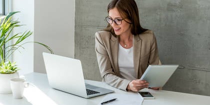 woman looking at data on laptop