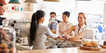 Women in cafe ordering