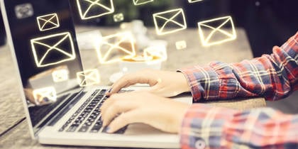 Woman typing on laptop