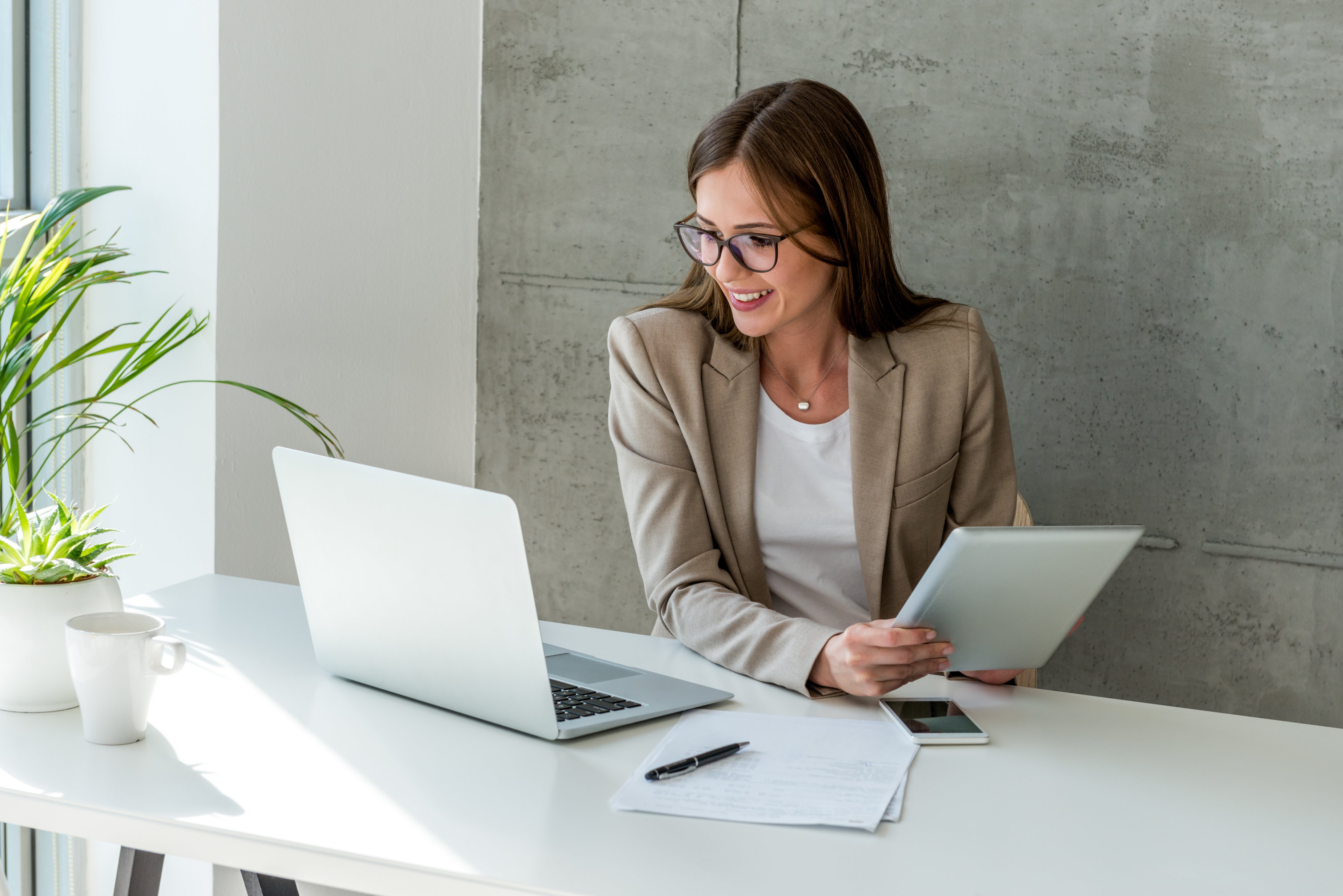 woman looking at data on laptop