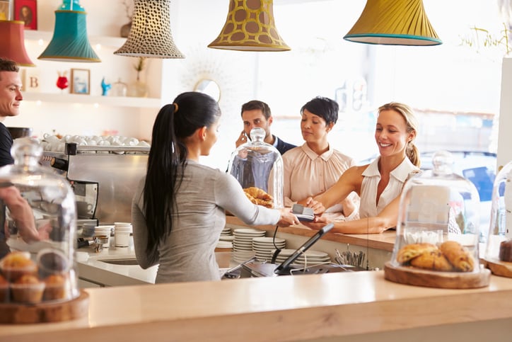 Women in cafe ordering